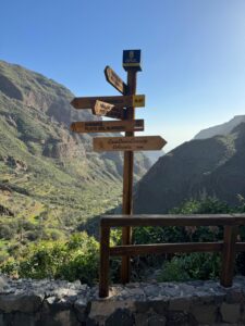 a sign post with many directions guayadeque